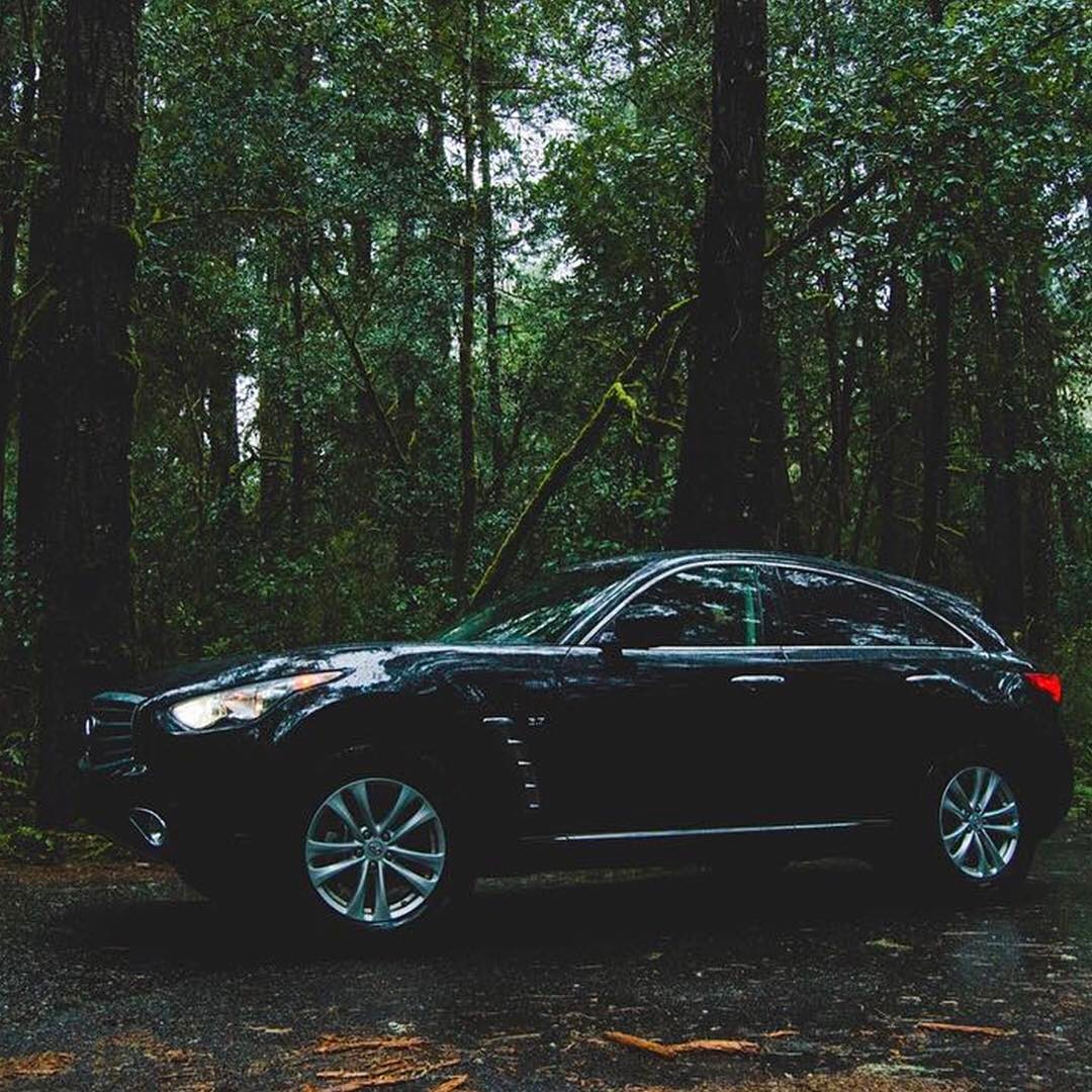 INFINITI QX70 Luxury Crossover SUV parked in jungle