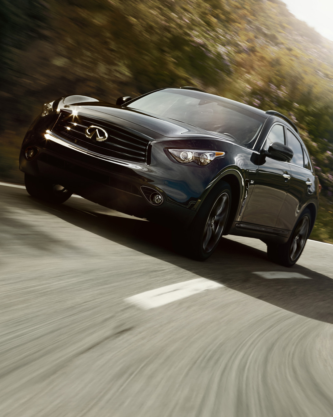 INFINITI QX70 Luxury Crossover SUV on road showcasing 3.5 liter V6 engine