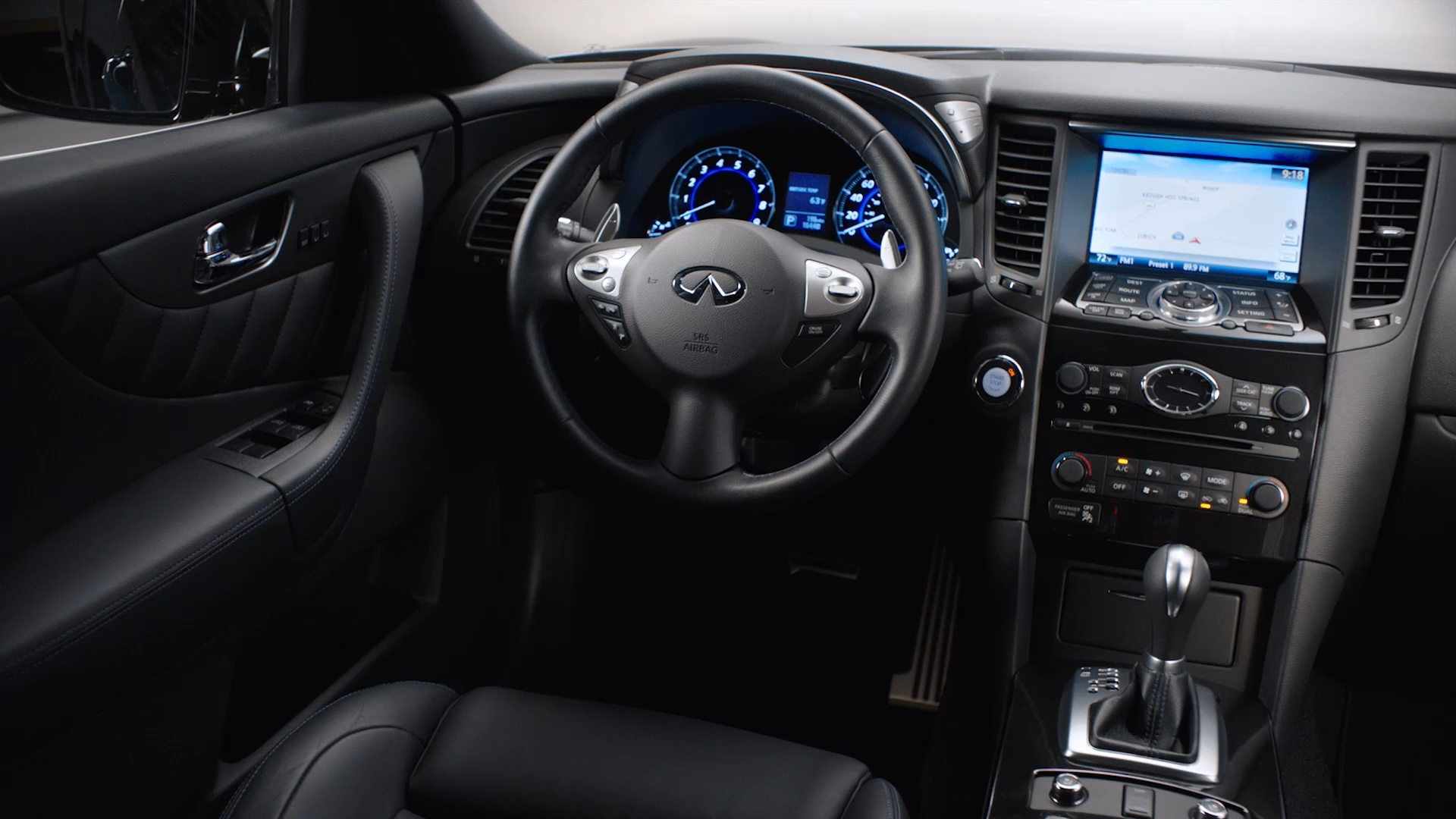 Interior view of INFINITI QX70 Luxury Crossover SUV steering wheel and dashboard 