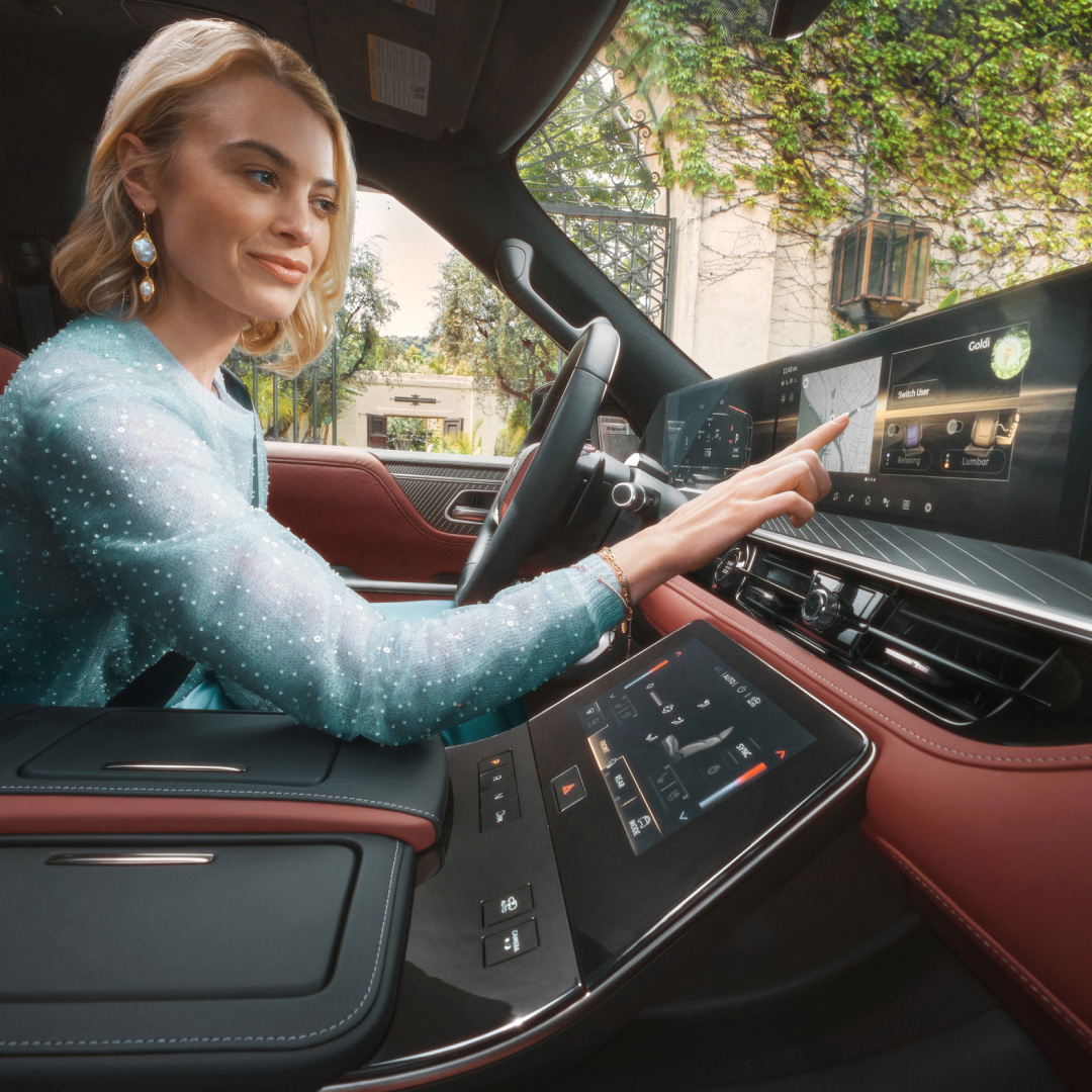 2026 INFINITI QX80 14.3-inch high-definition infotainment touchscreen in use