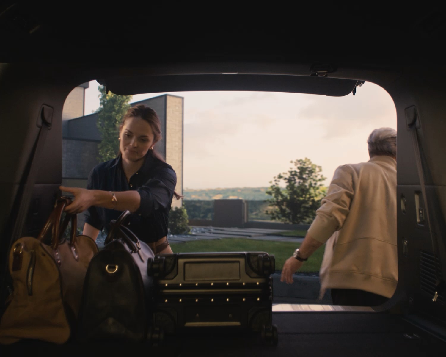 2026 INFINITI QX80 expanded cargo area with rear hatch open for loading luggage