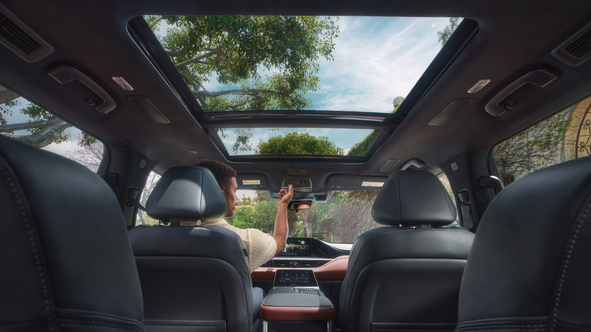 2026 INFINITI QX80 interior view featuring stylish panoramic moonroof