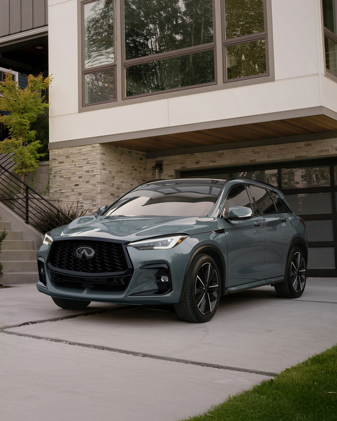 2025 INFINITI QX50 compact luxury SUV in urban residential setting