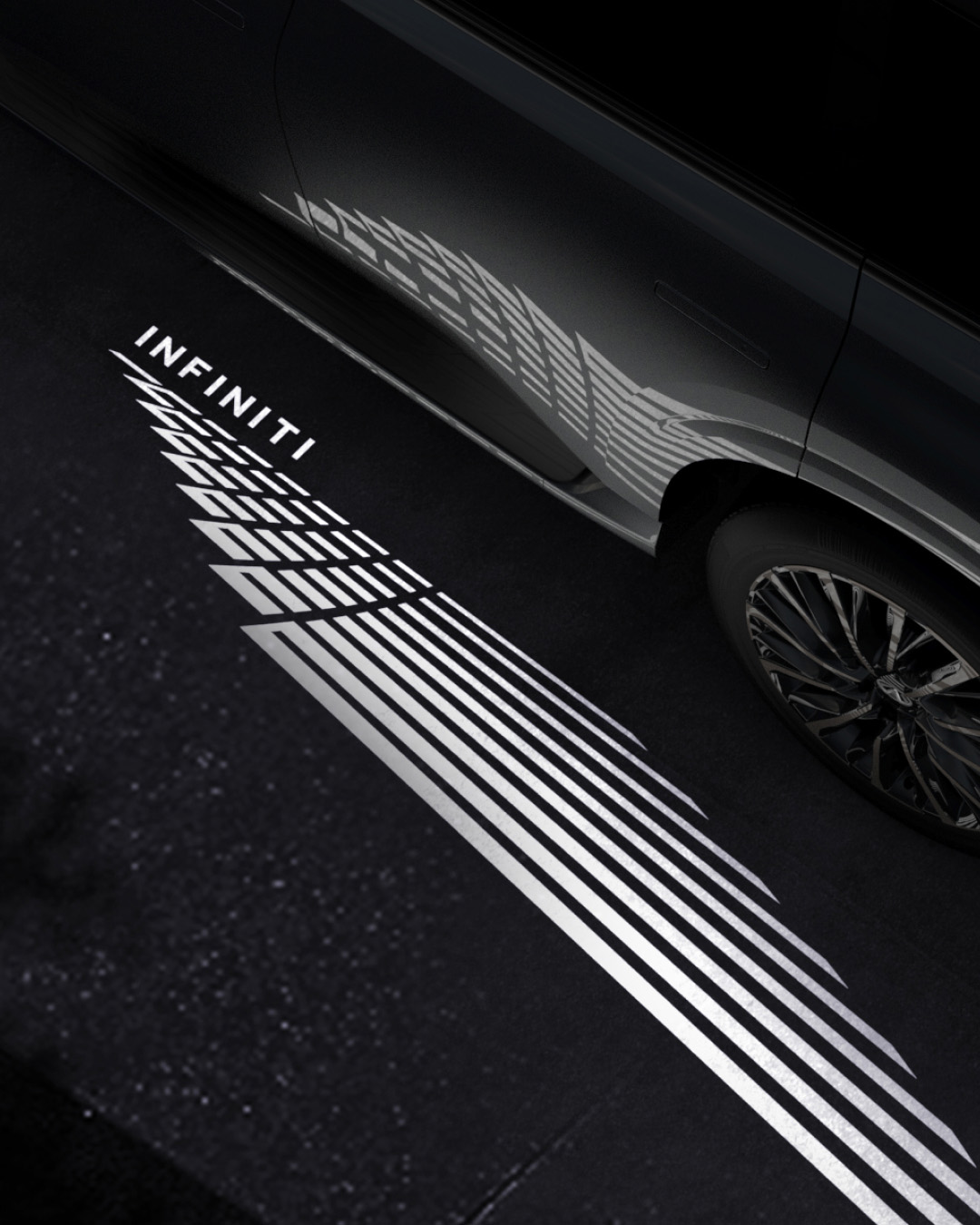 2026 INFINITI QX80 glowing light path projecting welcome design on pavement