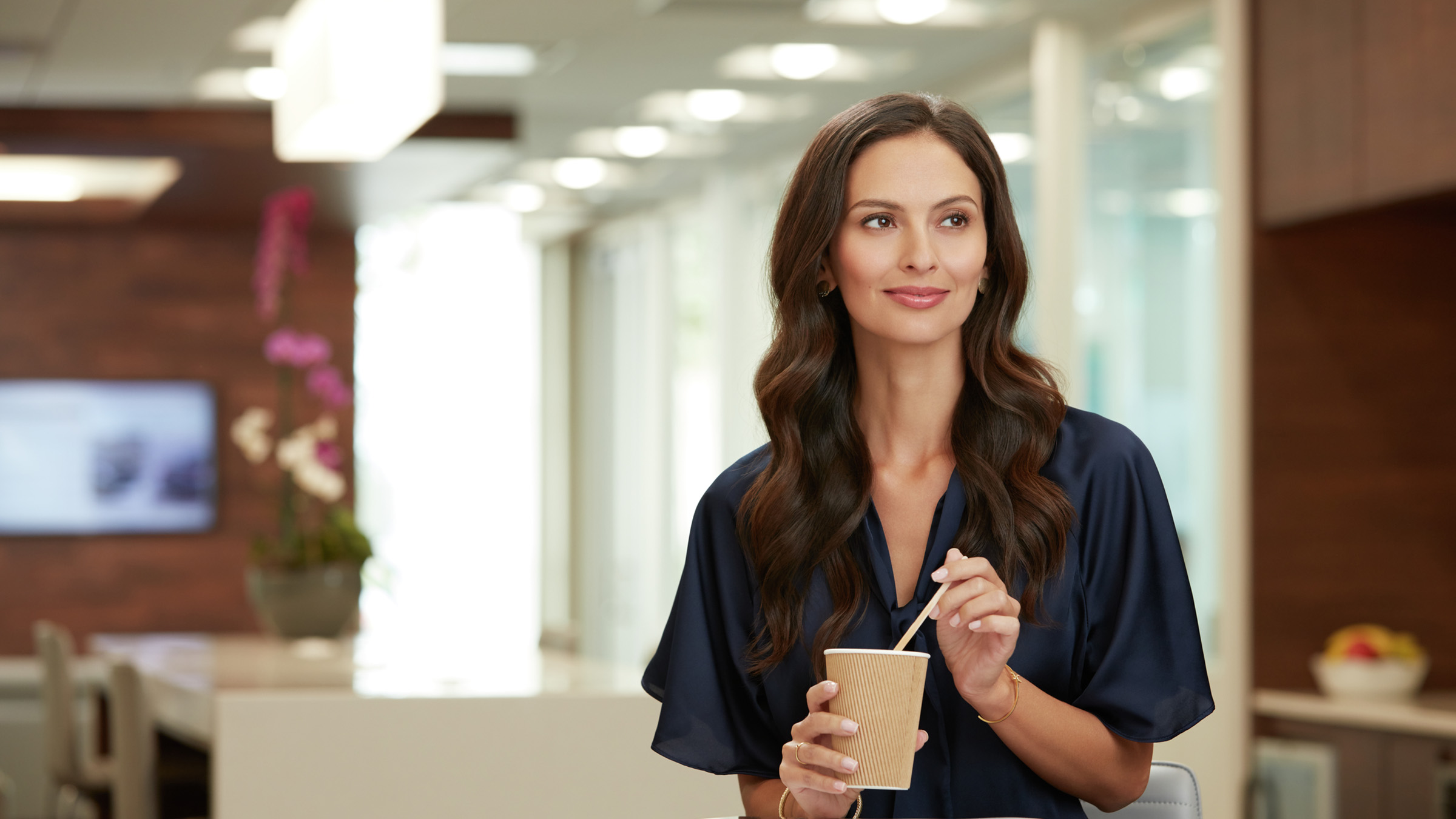 A women waiting for her 2022 INFINITI vehicle to be serviced.